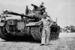 Jack Helms holding up an M-48 Tank!